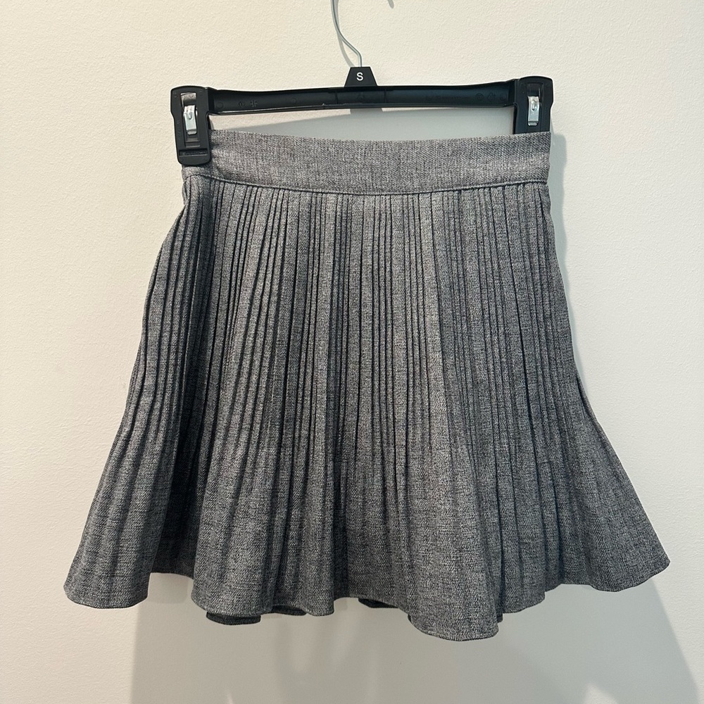 Grey skirt. Never been worn. Size S. Shorts on inside of skirt.